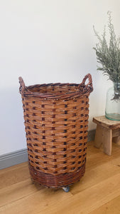 Vintage French bakery tall wicker basket on wheels