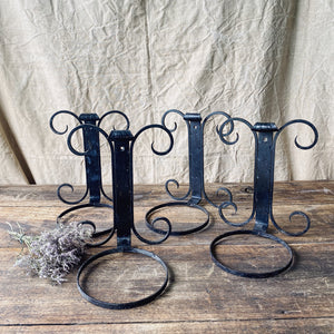 Black wrought iron wall mounted plant pot holder