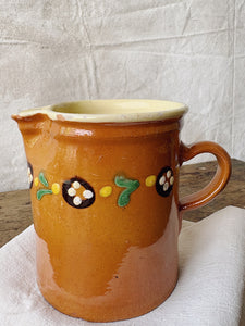Hand painted terracotta milk jug