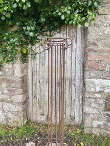 Vintage wrought iron Greek style garden column