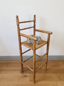 Vintage French high chair in oak and straw seat