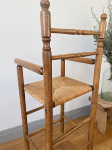 Vintage French high chair in oak and straw seat