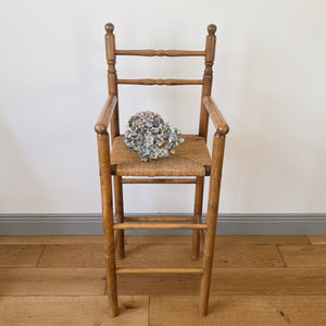 Vintage French high chair in oak and straw seat