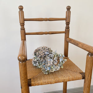 Vintage French high chair in oak and straw seat