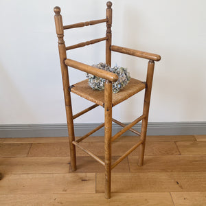 Vintage French high chair in oak and straw seat