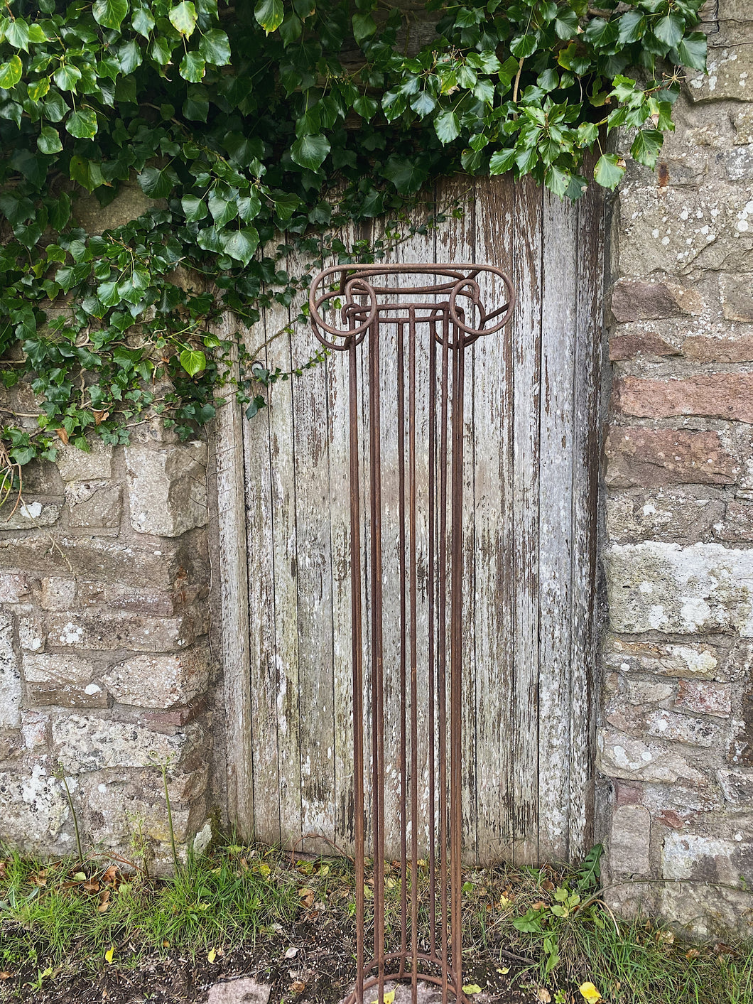Vintage wrought iron Greek style garden column