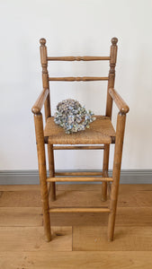 Vintage French high chair in oak and straw seat