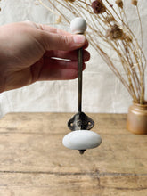 Load image into Gallery viewer, Antique Brass and porcelain hat and coat hook
