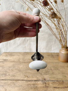 Antique Brass and porcelain hat and coat hook