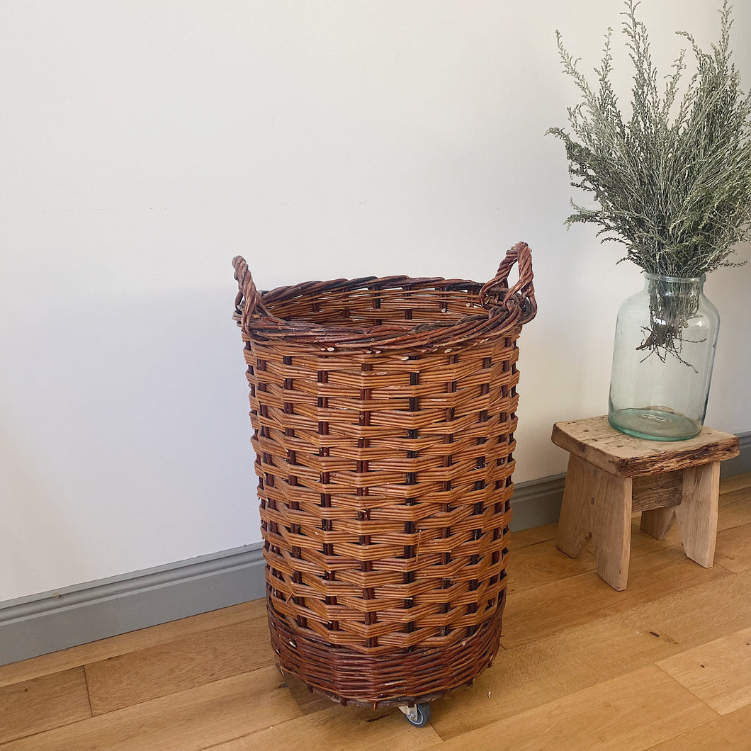 Vintage French bakery tall wicker basket on wheels