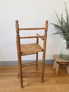 Vintage French high chair in oak and straw seat