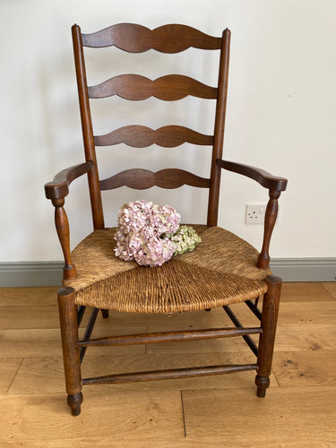 Vintage French ladder back low seat straw armchair