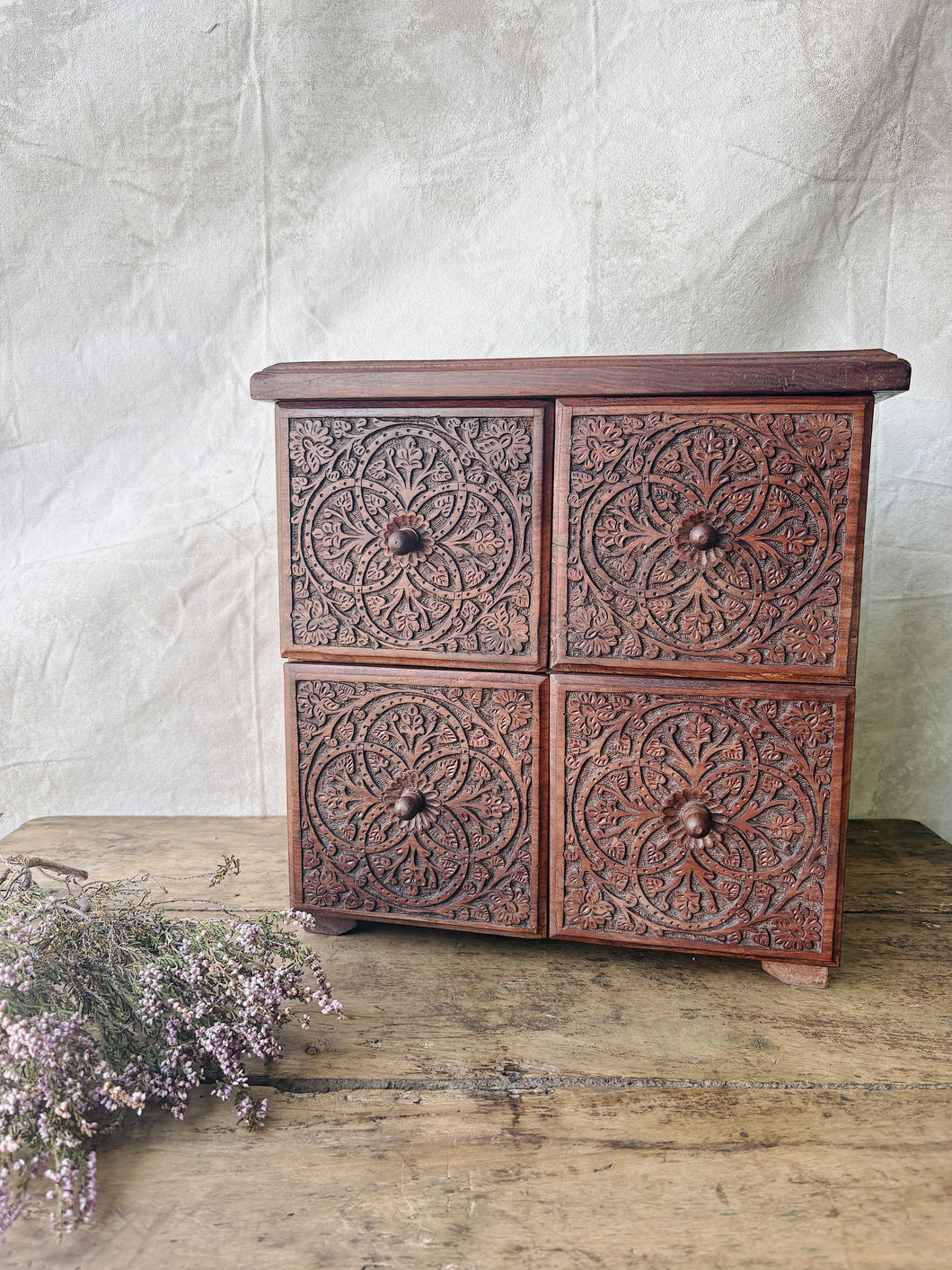 Handmade rosewood carved table top chest of drawers