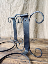 Load image into Gallery viewer, Black wrought iron wall mounted plant pot holder