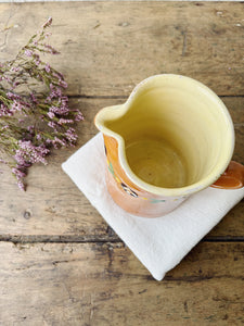 Hand painted terracotta milk jug