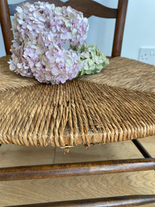 Vintage French ladder back low seat straw armchair