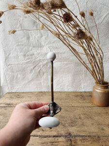 Antique Brass and porcelain hat and coat hook