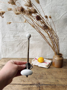 Antique Brass and porcelain hat and coat hook